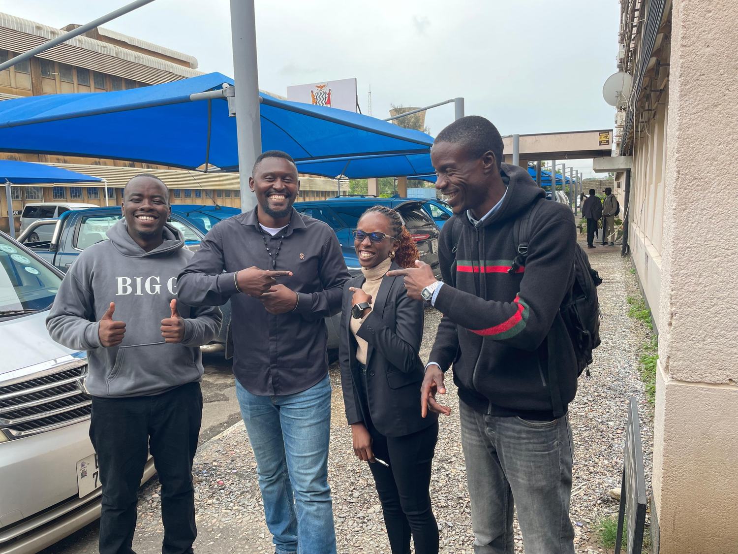 AKZAM team members meeting with leaders of the Zambian Music Association outside their offices