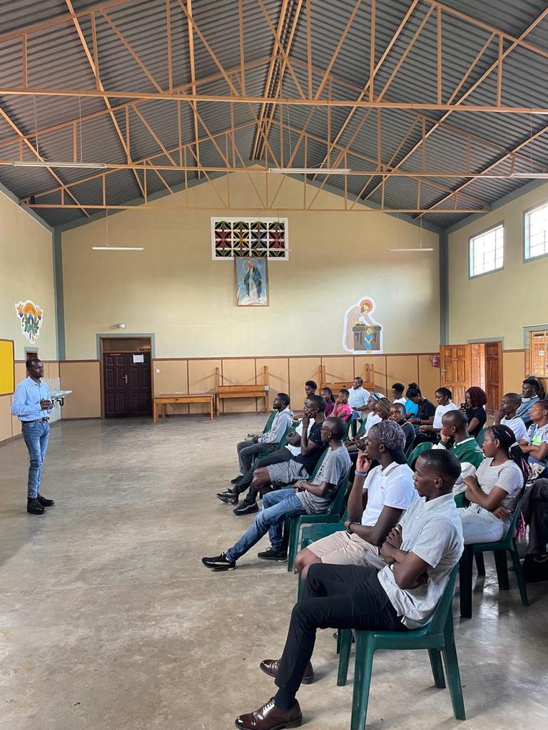 Young people attending an AKZAM Youth Talk in a parish hall